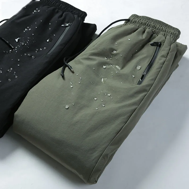 Зимние теплые мужские пуховые брюки 90% на белом утином пуху уличные спортивные