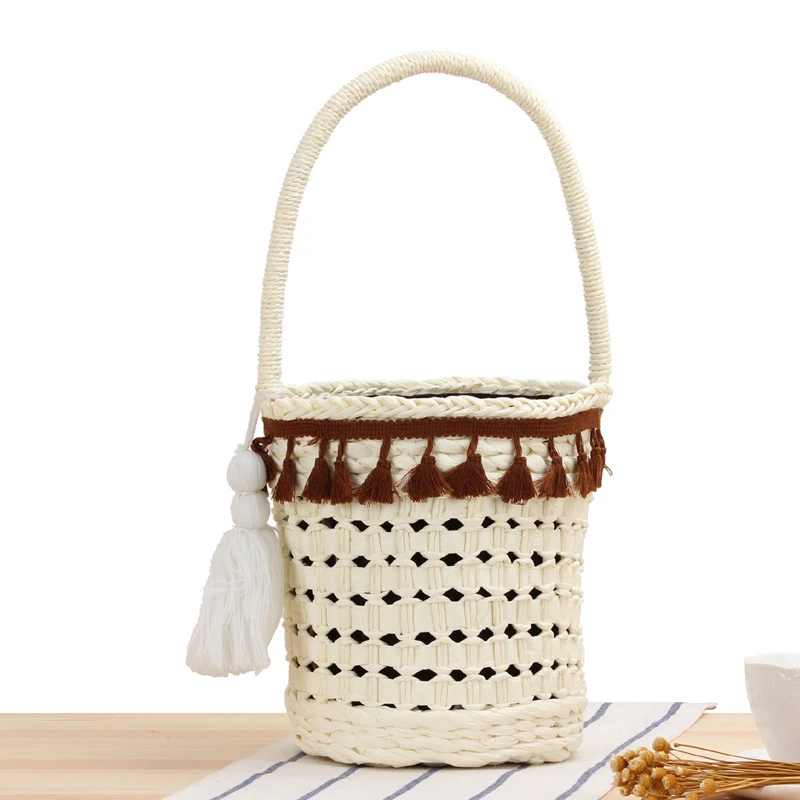 

2021 Summer New Three Color Straw Woven Bucket Bag Small High Quality Hollow Out Ladies Handbag With Tassel String Linging