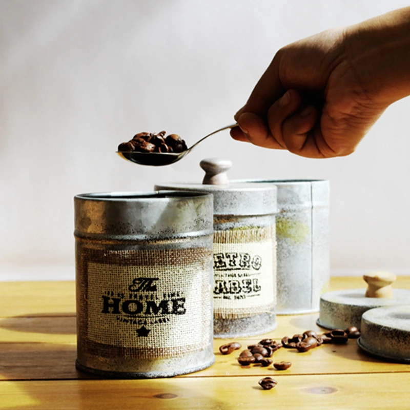 Зерна банки сохранение кованого железа с закрытыми фотографические реквизиты