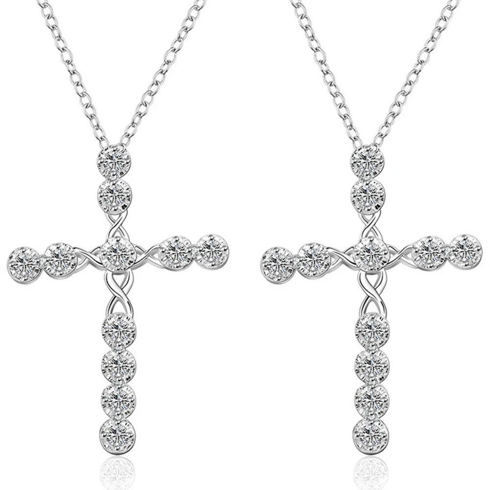 Женское ожерелье с крестиком из белого золота кристаллами в виде цветов и