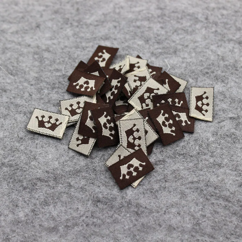 

Этикетки для головных уборов/тканые бирки с изображением короны/этикетки для одежды, пользовательские этикетки для воротника