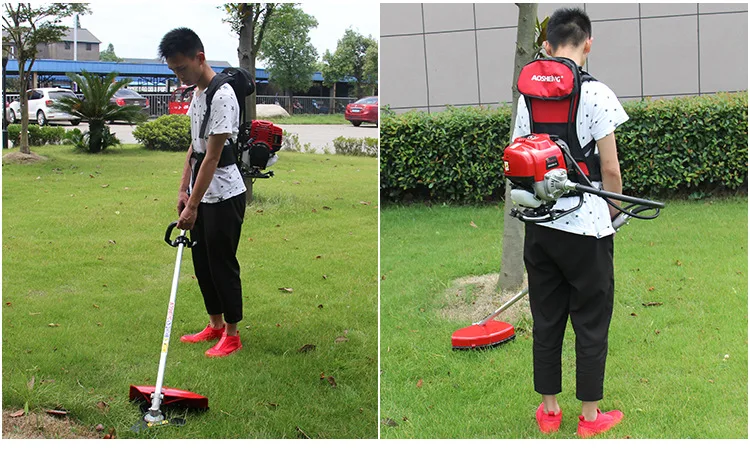 

Four-stroke lawn mower carrying a small household multifunctional gasoline lawn mower to open up wasteland and weeding harvester
