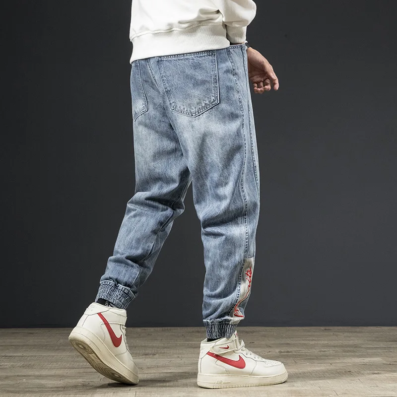 

Уличные модные мужские джинсы 2021, свободные дизайнерские шаровары в полоску, брюки-карго, Сращенные джинсы с вышивкой в стиле хип-хоп, джогг...