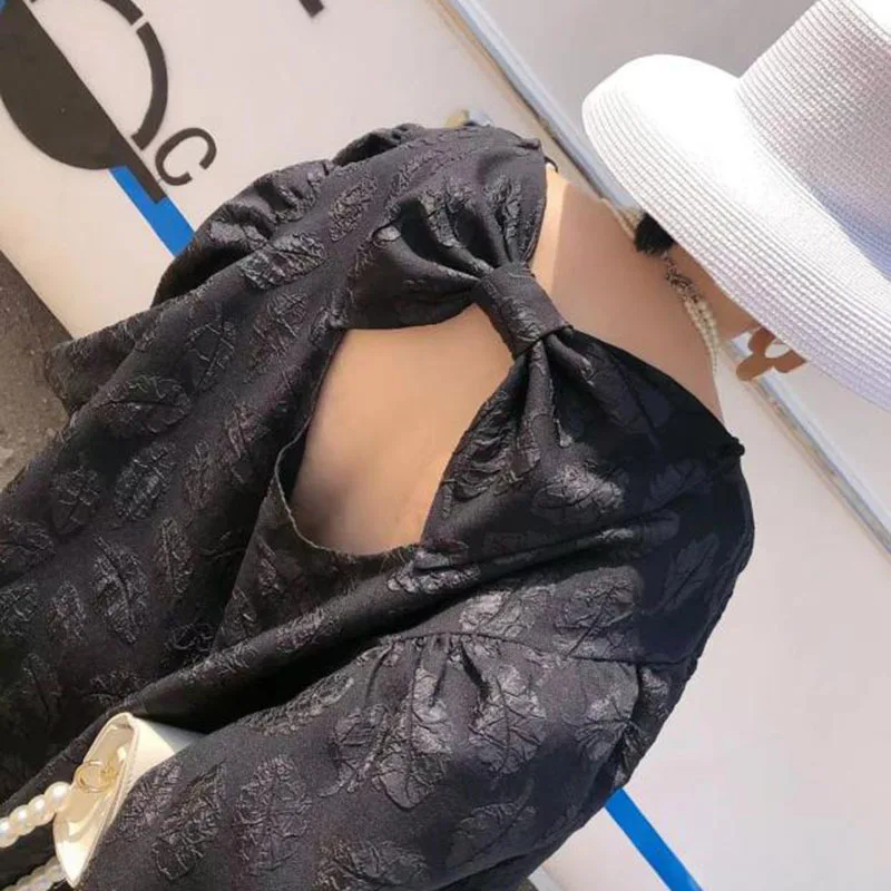 

[EAM] Women Black Big Size Backless Bow Jacquard Dress New Round Neck Long Puff Sleeve Loose Fashion Tide Spring 2021 1DD7471