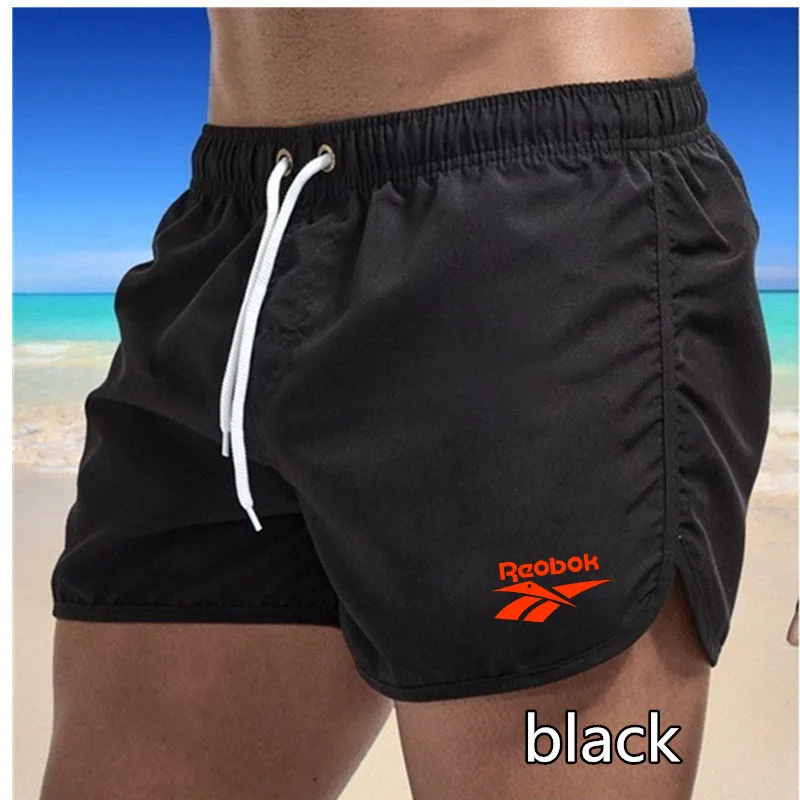 

2021 summer casual shorts men's loose three-quarter pants sports shorts loose straight leg casual pants beach shorts
