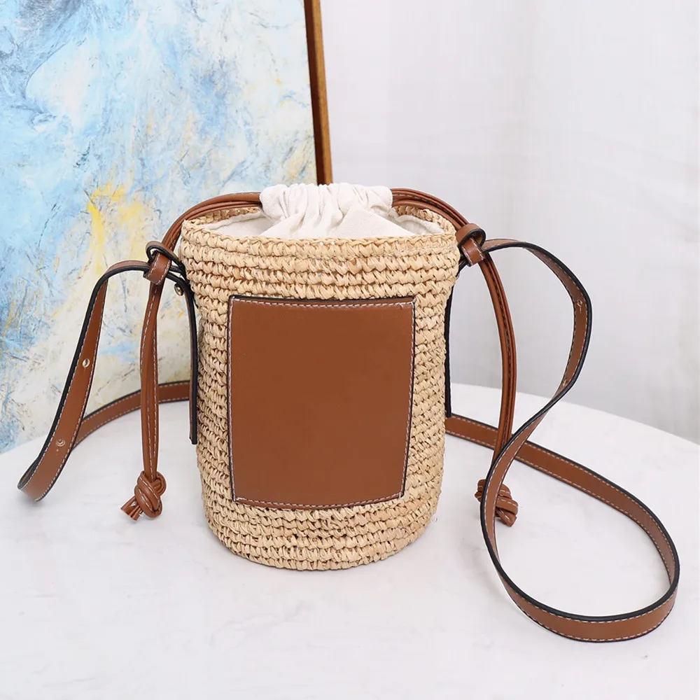 

Summer new style straw woven barrel drawstring shoulder messenger bag