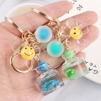 creative acrylic small cup daisy keychain liquid quicksand smile keyring for women girl bag airpods pendant key chains gifts