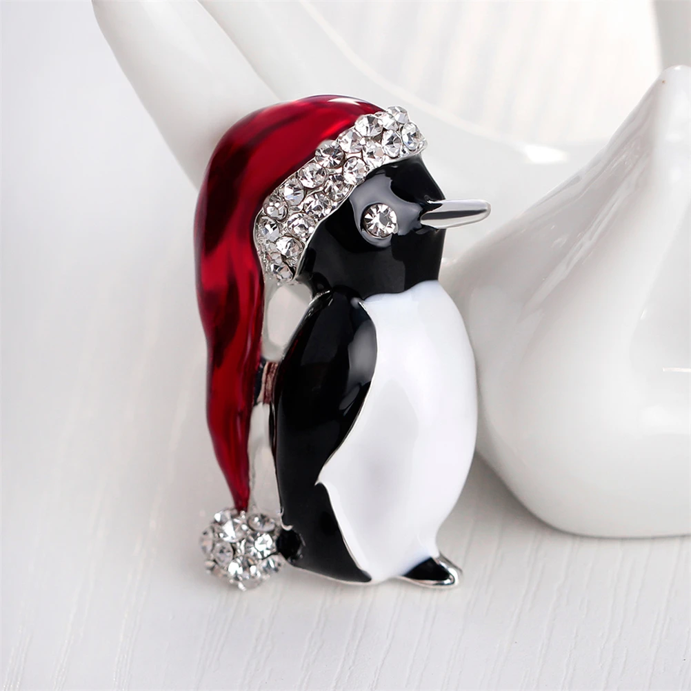 

Lovely Penguin Brooches Christmas Gifts Enamel Rhinestones Ball Red Hat Penguin Christmas Brooch for the New Year