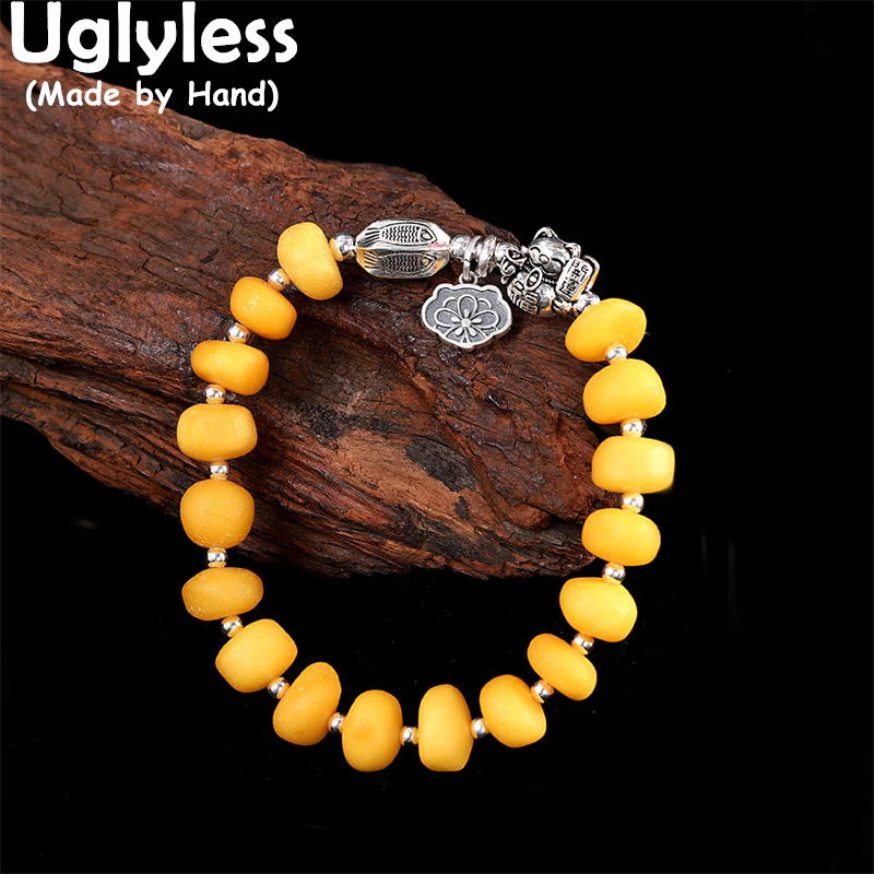 

Uglyless Elastic Rope Thai Silver Lucky Cat Bracelets for Women Natural Chicken Oil Amber Beeswax Bracelets 925 Silver Jewelry