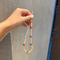 soft pottery strawberry beaded phone chains imitation pearls mobile phone lanyards glass rice bead ornaments pendant for women
