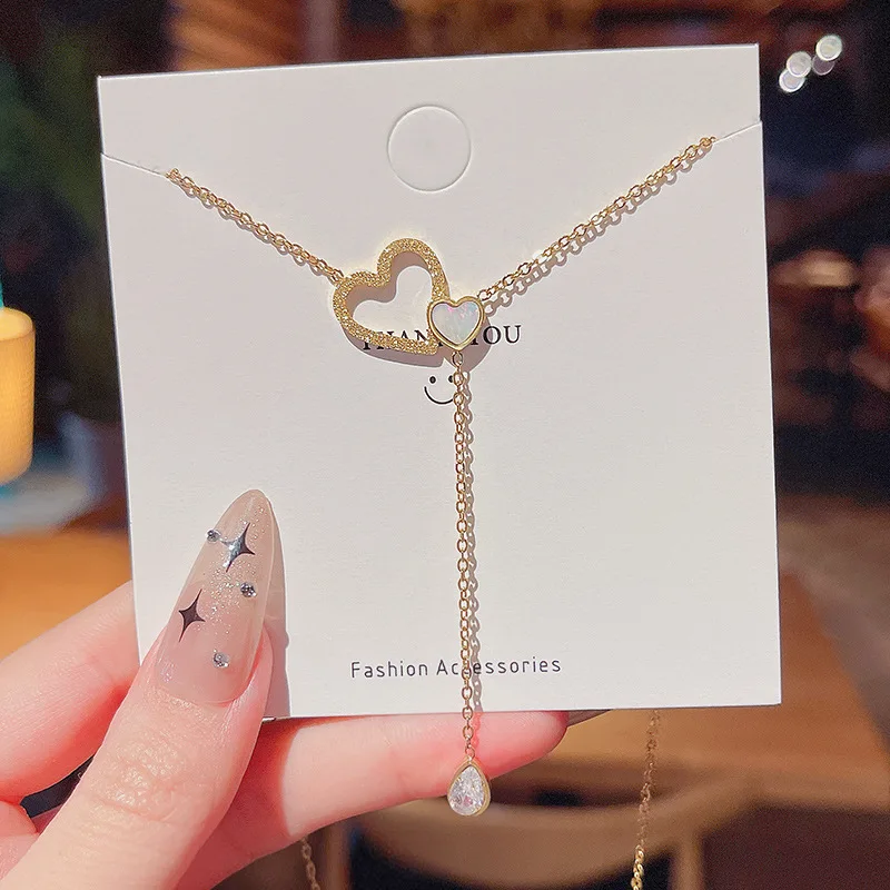 

Korean version of simple and fashionable heart-shaped diamond-studded mother-of-pearl necklace, exquisite clavicle chain