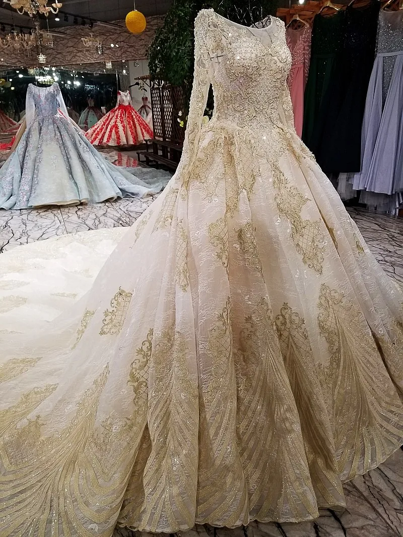 Свадебное платье цвета шампанского и золотого с длинным рукавом настоящие