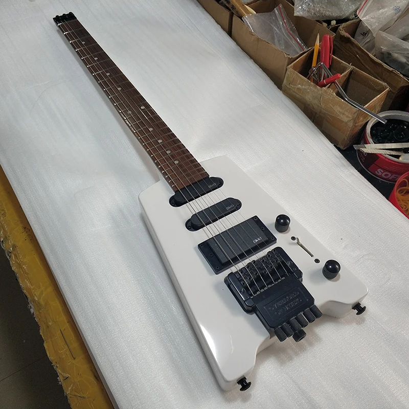 

Headless Electric Guitar 6 String Mahogany Body Maple Neck Rosewood Fingerboard Black Hardware White Gloss Finish