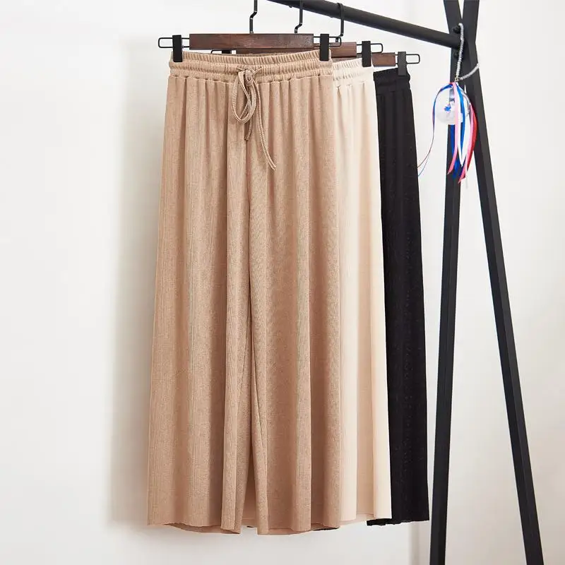 Женские летние тонкие трикотажные брюки черные широкие свободные до щиколотки