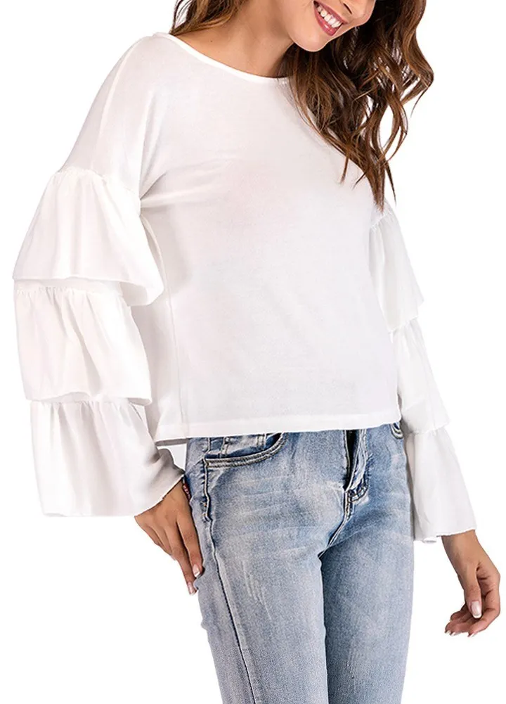 Женская блузка с оборками расклешенная длинными рукавами круглым вырезом