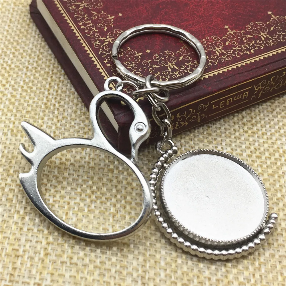 

1 шт. брелки яркий лебедя стерлингового серебра браслеты с подвесками с фокусным расстоянием 25 мм Вращающийся 2 боковых пустой базовые кабош...