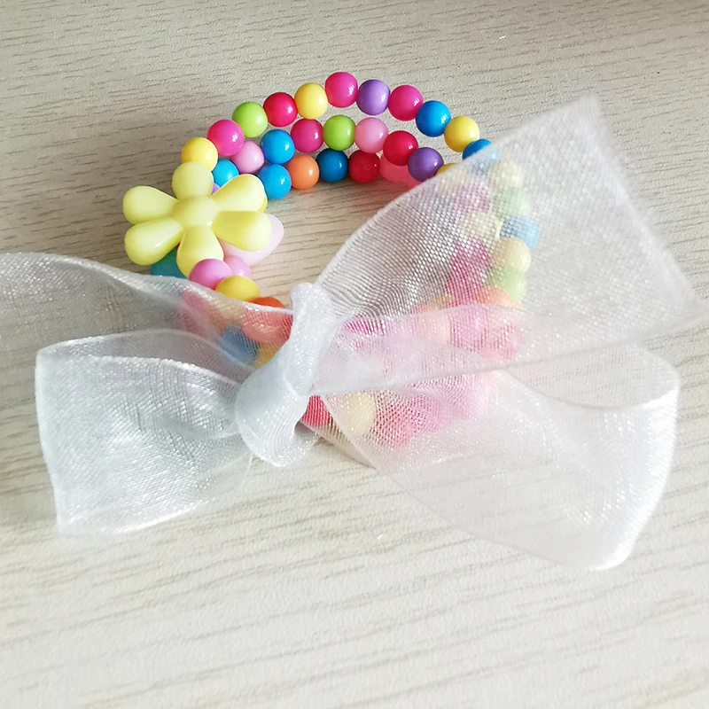 Набор браслетов из акриловых бусин карамельные конфеты бант цветок буквы