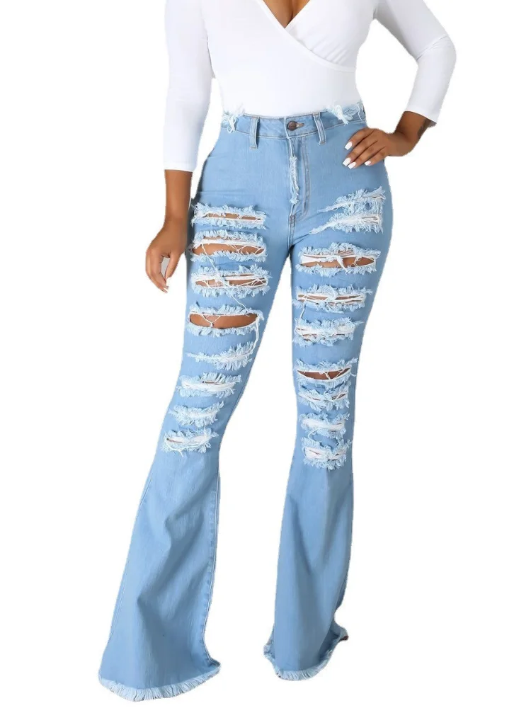 Джинсы женские рваные расклешенные с высокой талией дырки в джинсах |