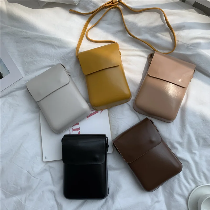 

New fashion female bag summer one-shoulder fashion trend messenger bag solid color clamshell vertical small square bag Satchel