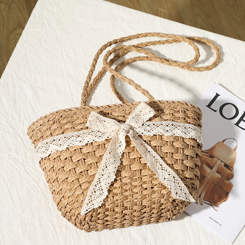 

2021 New Lace Bow Straw Woven Fashion Girls Handbag Fairy One Shoulder Portable Beach Bag Women's Summer Holiday Shoulderbag