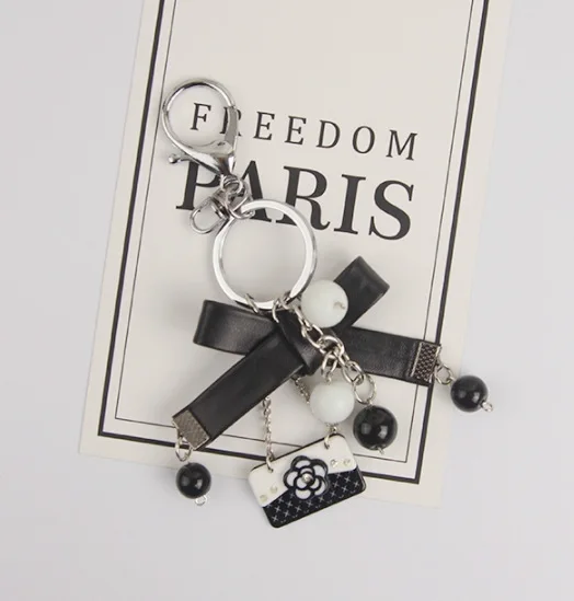 

Korea Elegent Luxury Camellia Flower Bowknot Keychain Purse Pompom Pearl Keyring For Girl Women Key Ring Car Bag Pendent Charm
