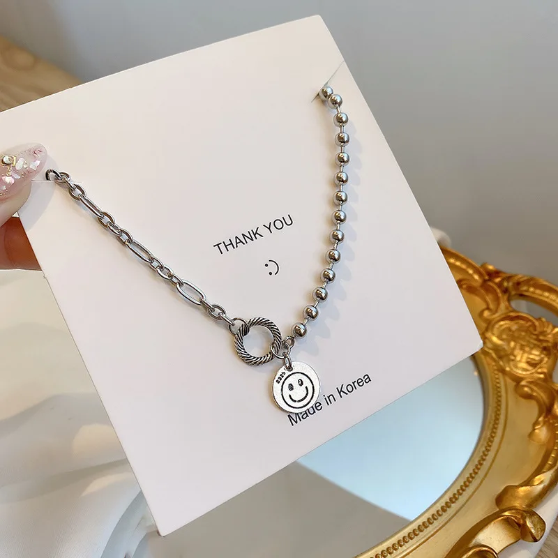 

European and American personality retro smiling face pendant titanium steel necklace female temperament exquisite clavicle chain