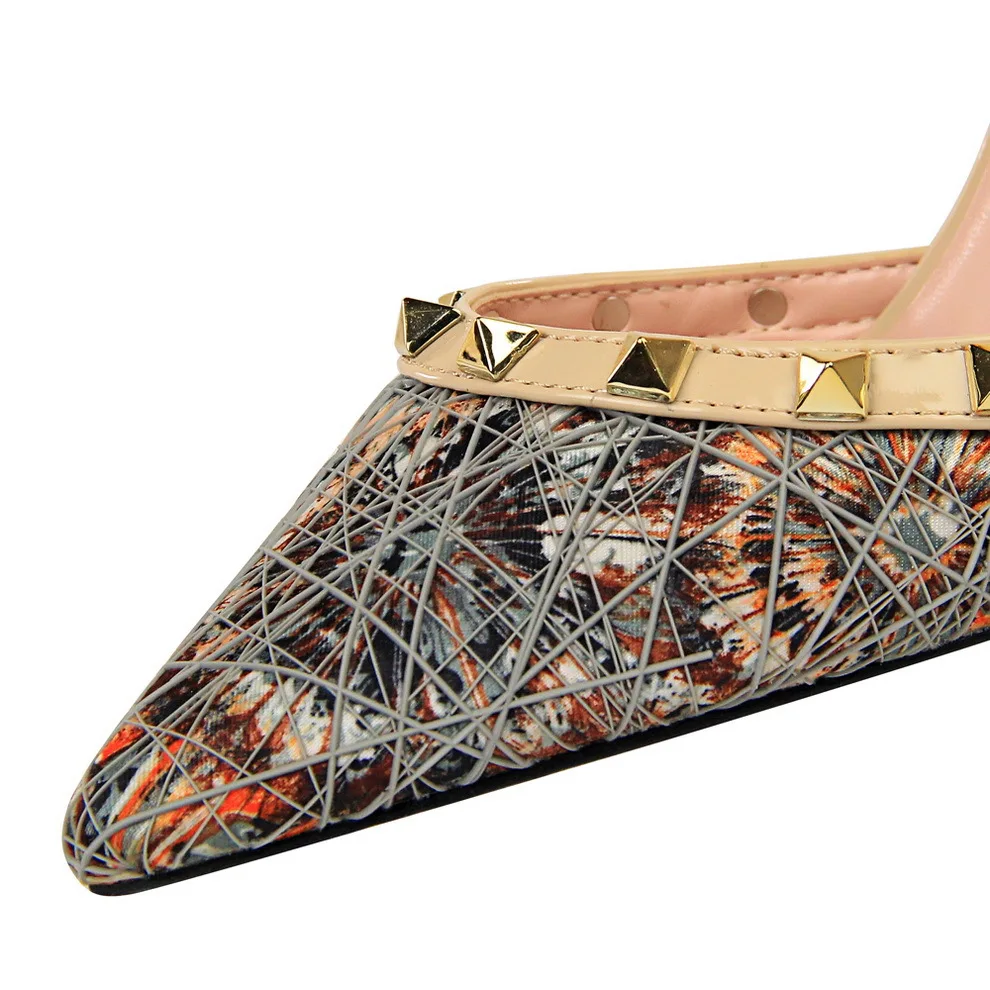 

2019Spring New Sexy High Heel Women Stiletto High Heel Shallow Mouth Pointed Hollow Metal Rivet Word With Sandals
