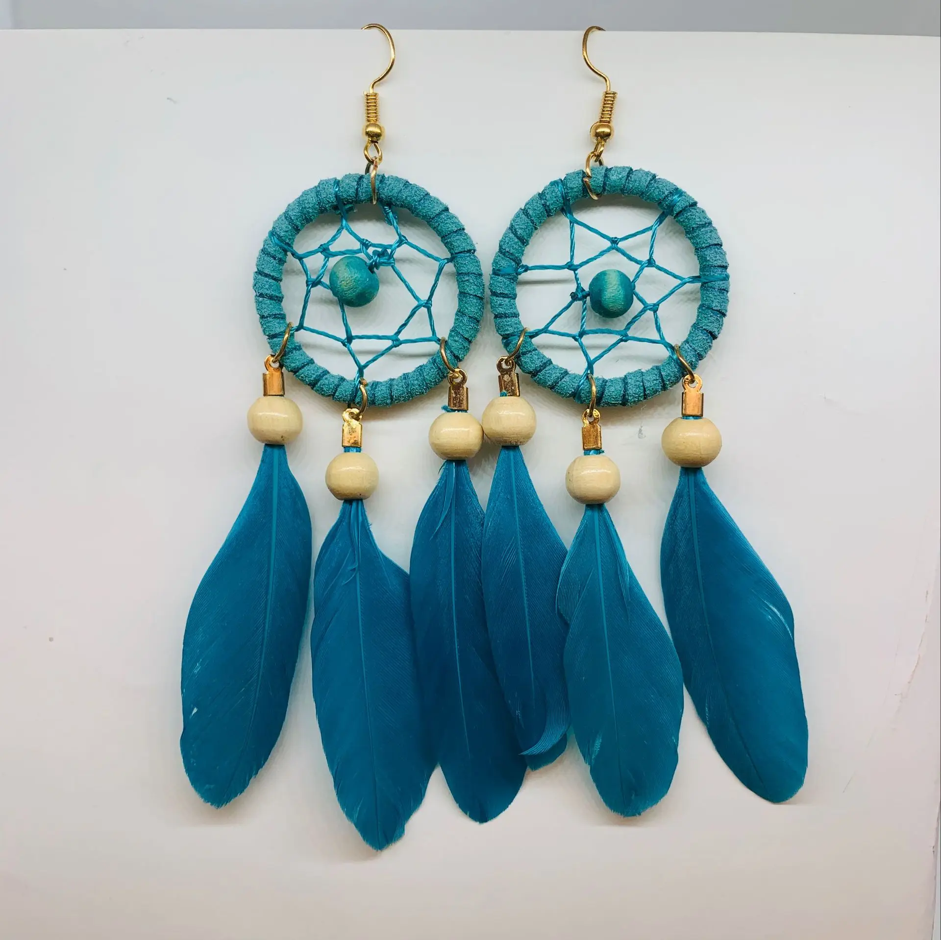 

2021 new fashion wish wooden bead dream catcher feather earrings Bohemian feather scenic seaside photo feather earrings female
