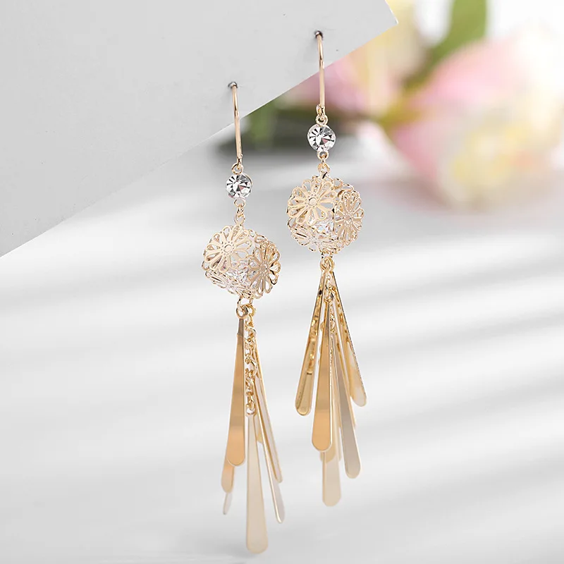 

Retro Chinese style earrings hollow carved long earrings temperament personality zircon ear hooks