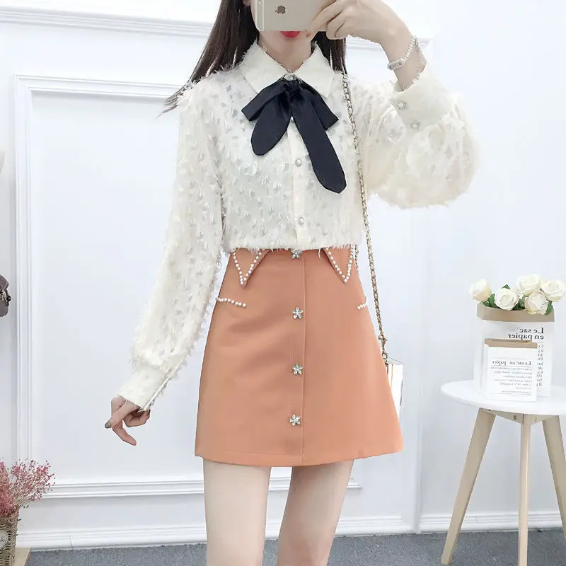 

2020 Women Autumn Temperament Skirt Suits Turn Down Collar Long Sleeve Bow Shirt and Beading Crystal Mini Skirt 2 Peice Set Z387