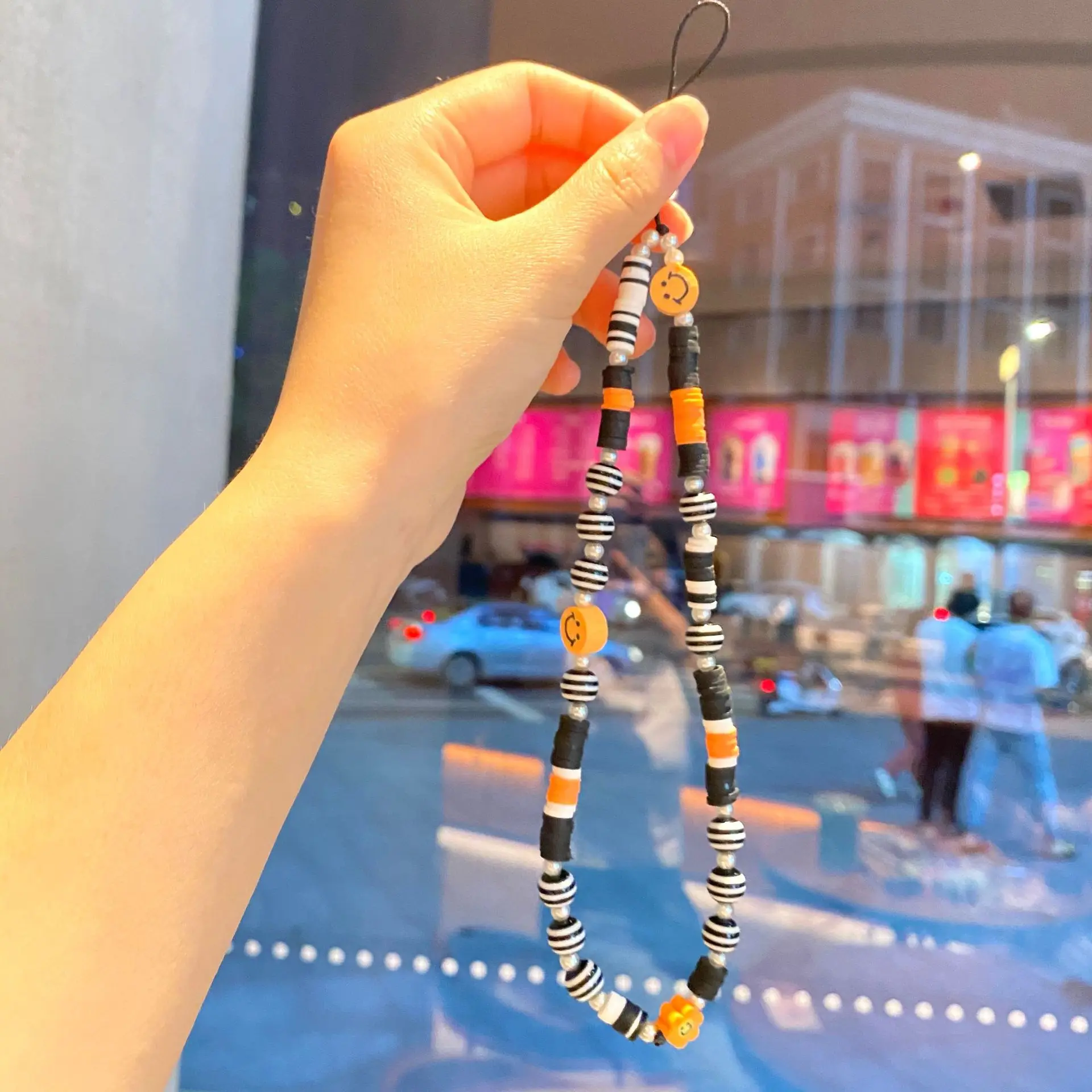 

Fashion Black and Orange Soft Pottery Anti-lost Mobile Phone Chain Female Short Cell Phone Lanyard Bracelet