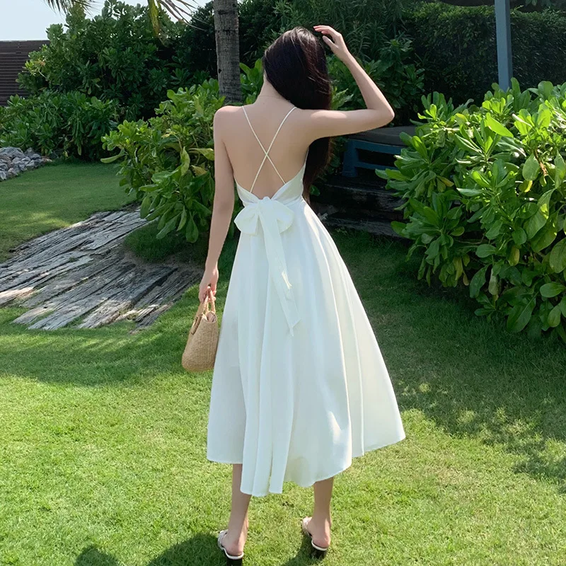 

New beach skirt seaside sexy backless holiday skirt temperament long skirt slim satin backless suspender skirt female summer