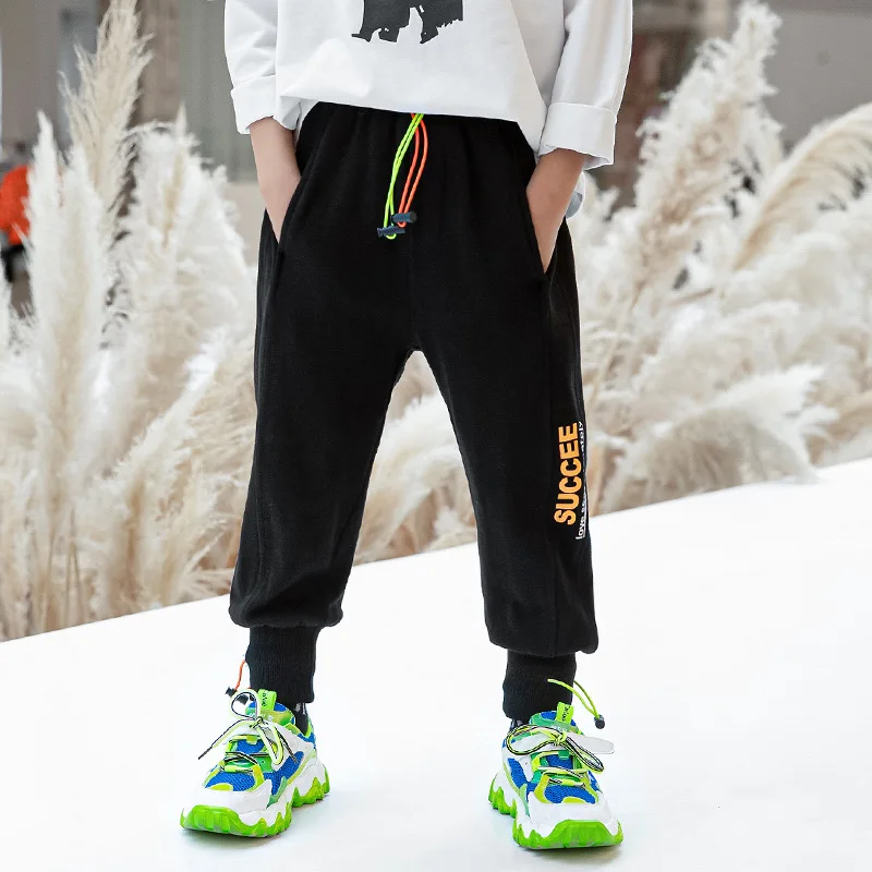 

Children's clothing boys spring 2021 new big children's children's pants casual letters sports trousers trend