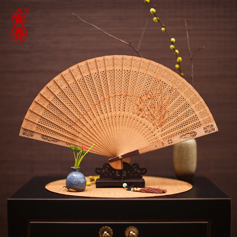 

Red sandalwood fan hollow fan Chinese style folding fan craft fan abroad gift fan sandalwood fan dropshipping 2021 new arrivals