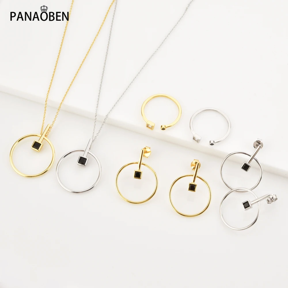 

Женские серьги-гвоздики в виде кольца, серебристого и черного цветов