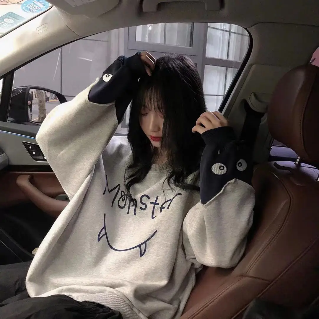 

2021 Autumn New Korean Version Loose Cartoon Little Monster Print Stitching Contrast Sweater
