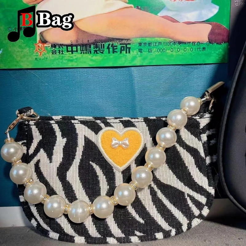 Женская мини-сумка через плечо с принтом зебры и бантом жемчужной цепочкой |