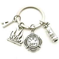 eative mini cute fireman key ring souvenir car key ring jewelry gift fire extinguisher fire medal fashion pendant 26 letters