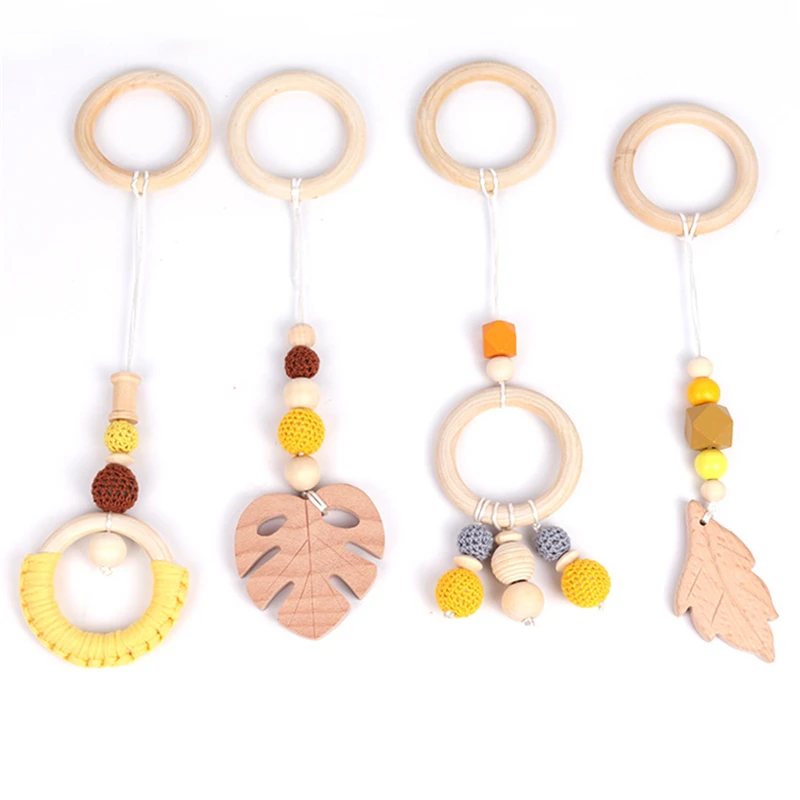 

4pcs Baby Wooden Rattle Toys Hanging Play Gym Wood Beads Leaf Pendant Teether Nursing Stroller Toys 0-12 Months Room Decoration