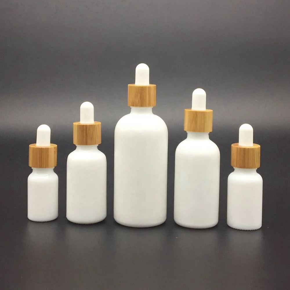 Wholesale Customized White Porcelain Round Shoulder Dropper Bottle With Bamboo Lid Cap Essential Oil Perfumes Cosmetic Packaging