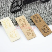100pcs soft suede faux leather sewing tags handmade baby bear pu label tags garment sewing tag for diy hat glove shoe