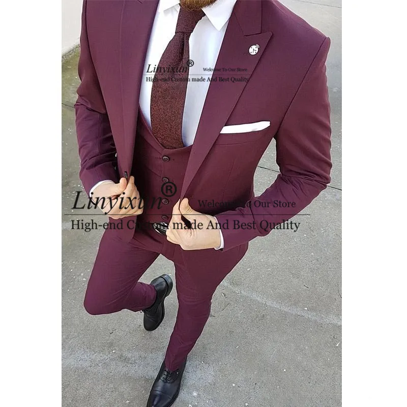 

New Burgundy Groom Tuxedos Peak Lapel Groomsmen Mens Wedding Dress Fashion Man Jacket Blazer 3Piece Suit(Jacket+Pants+Vest)