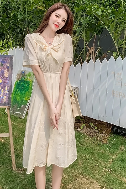 

COIGARSAM Cute Solid Women dress New Summer Short Sleeve Elastic Waist Dresses Pale Apricot 661