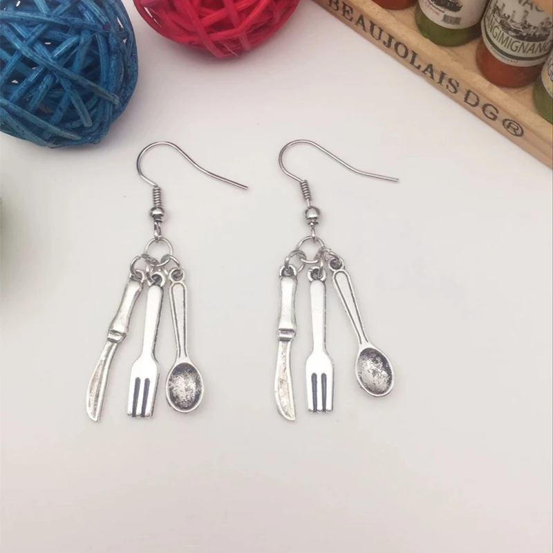 

Worker with knife, fork, spoon, alloy jewelry earrings dinner