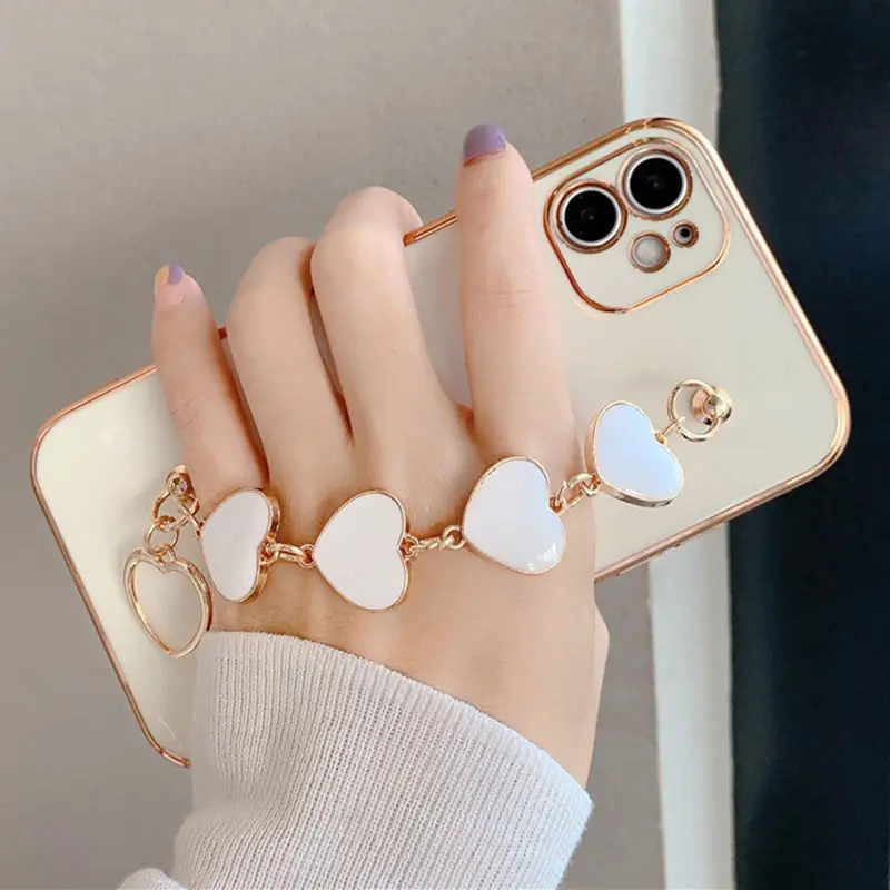 

12 Pro Case Luxury Plated Electroplated Gold Love Heart Hand Bracelet Cover For iPhone 12 11Pro Max 8 Plus 7 XR XS X SE 11 Cases