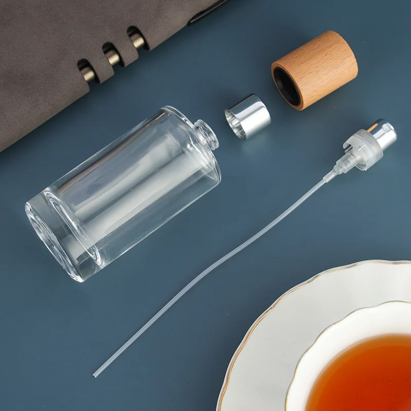 

High-grade 50MLCrystal White Material Cylindrical Wood Cap Bayonet Glass Bottle (Need Tools)