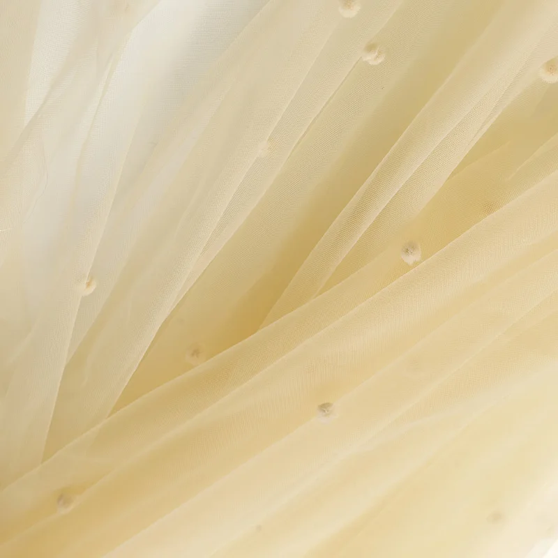 Марлевая ткань абрикосовая мягкая пряжа кружевная ручной работы фон свадебного