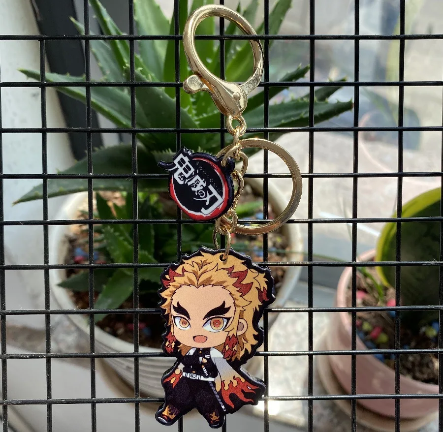 

Anime Demon Slayer Acrylic Keychain Cute Brinco Blade Of Ghost Key Chain Kamado Tanjirou Cosplay Pompom Yaiba Keyring Pendant