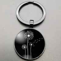 round dandelion cabochon black keychain