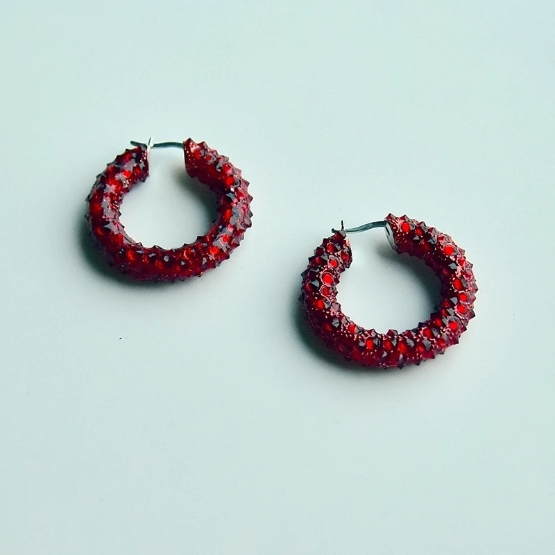 

Europe and the United States popular shiny circle red earrings sharp cone unique personality fashion circle circle earrings